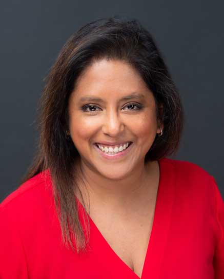 smiling woman in red shirt