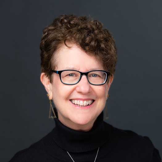 smiling woman with glasses