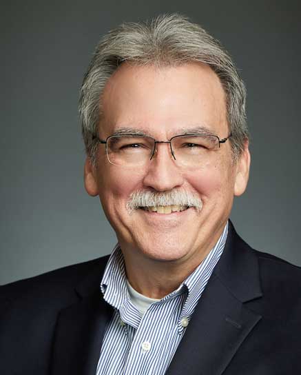 smiling man with glasses
