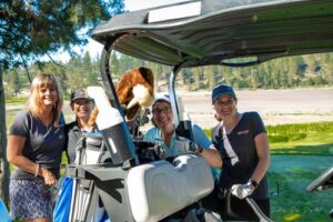 four ladies in a golf cart