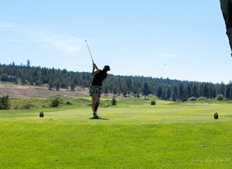 swinging golfer