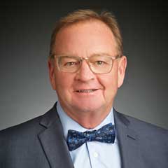 smiling man with bow tie