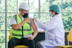 constrution worker getting vaccine