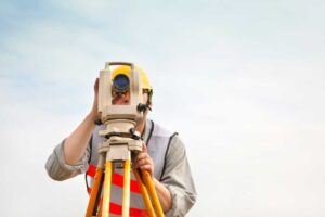 man behind survey equipment