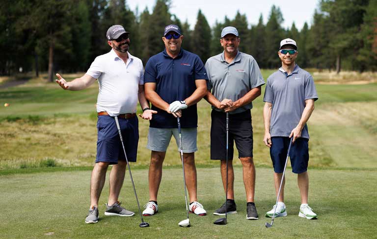 four golfers