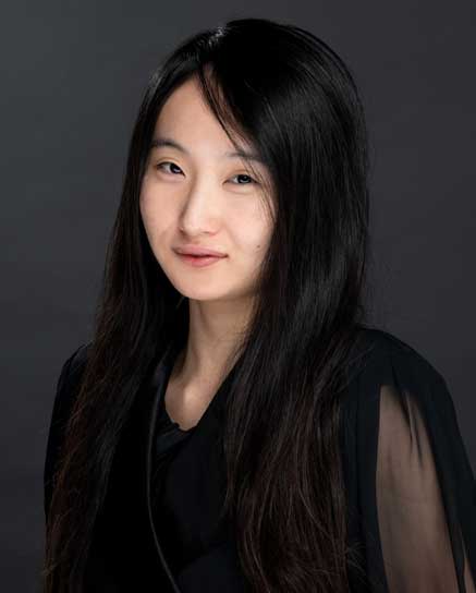 smiling woman with long black hair