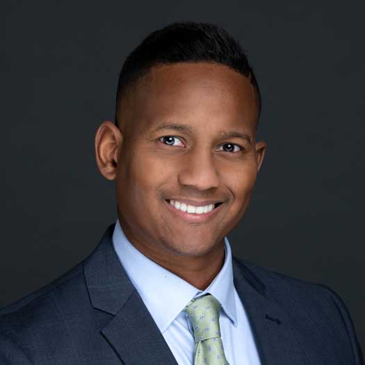 smiling man wearing a tie