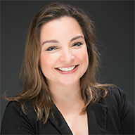 woman smiling up in suit jacket