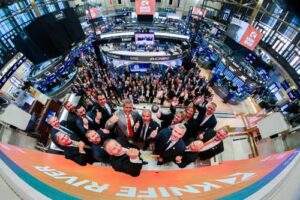 group standing at the at NYSE