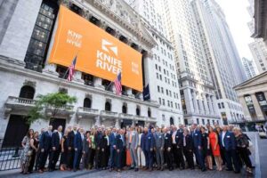 group standing in front of the NYSE