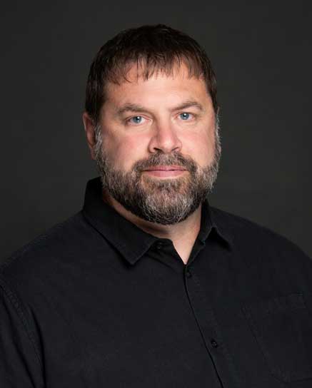 bearded man wearing black shirt