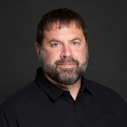 bearded man wearing black shirt