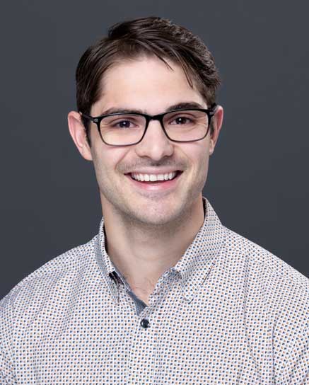 smiling man wearing glasses