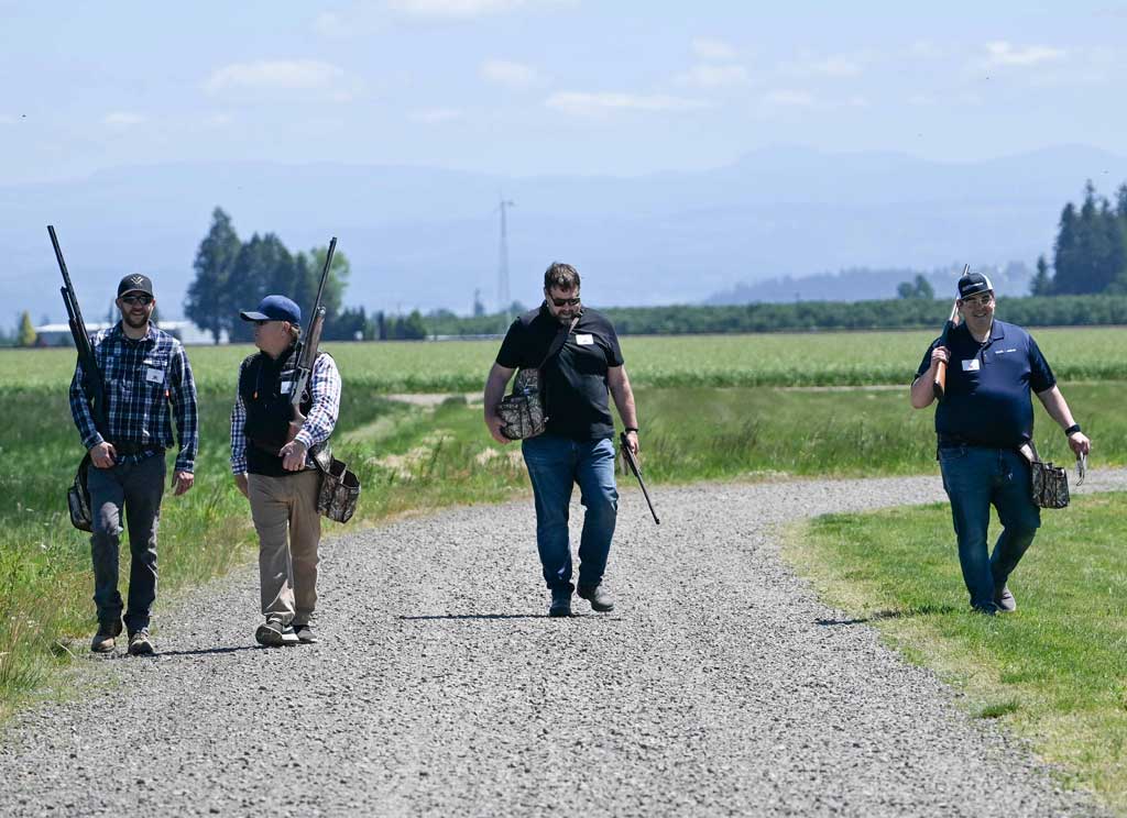 four men walking