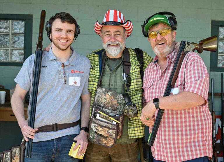 three men with shooting gear
