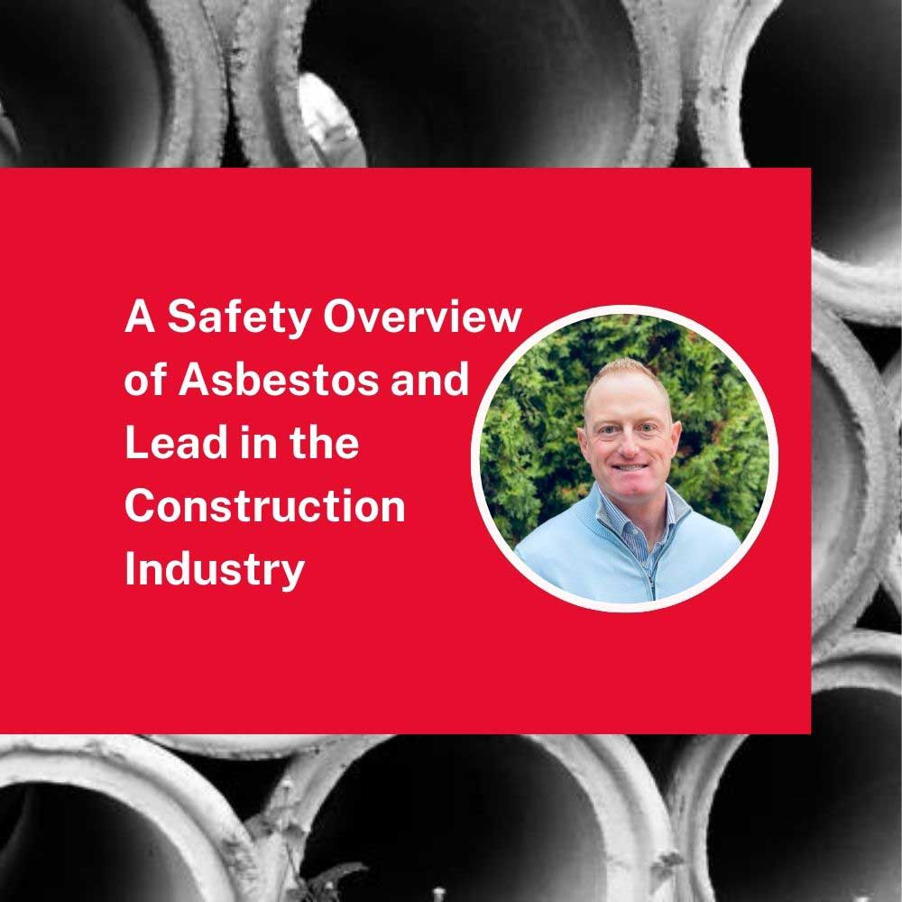 smiling man with construction pipe in background