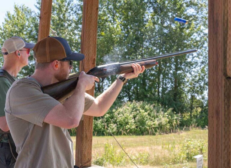 man shooting a rifle