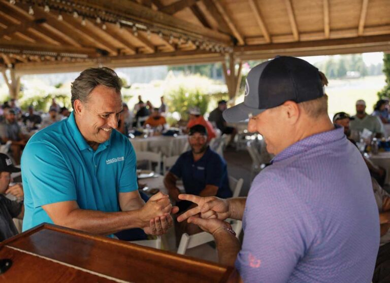 two men playing rock, paper, scissors