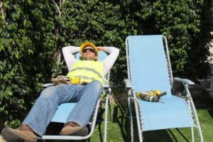 construction worker kicking back in a lounge chair