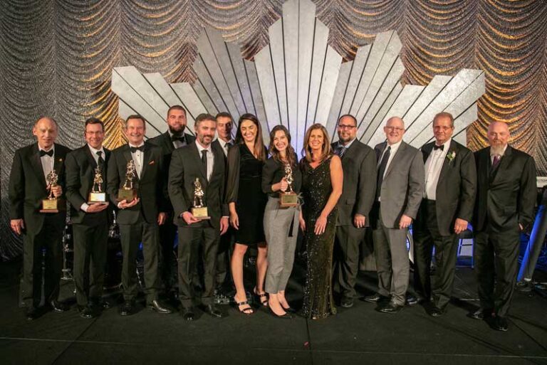 big crowd of men and women with trophys