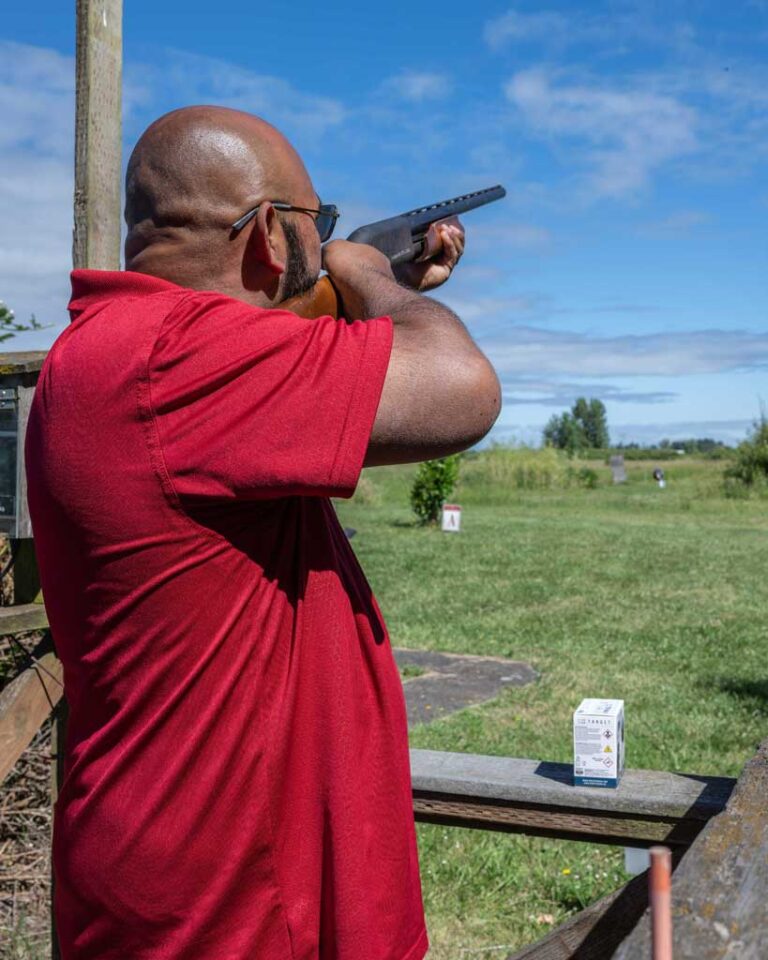 man shooting rifle at range