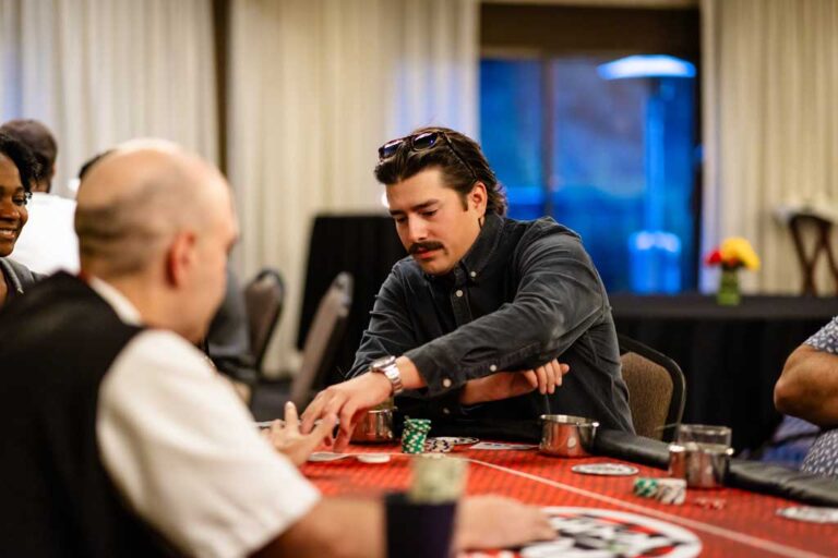 a man and dealer playing poker