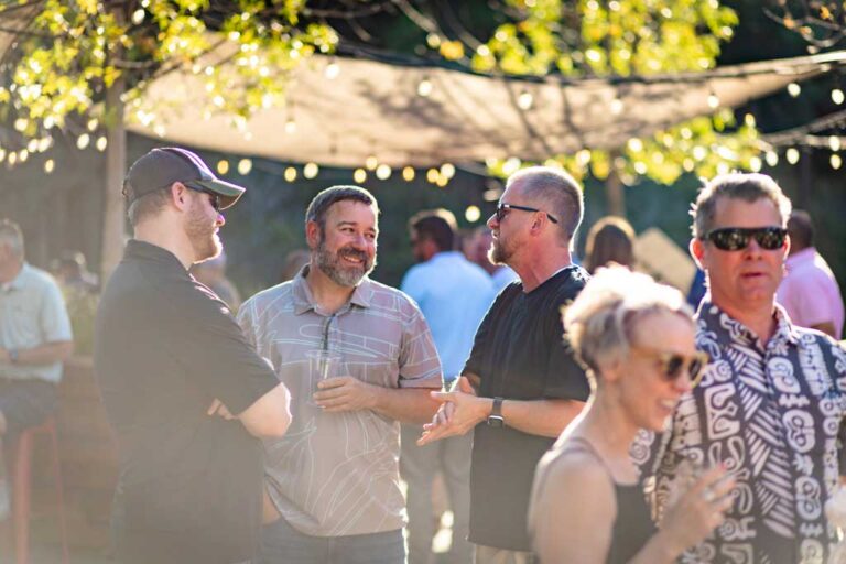 three men chatting at outdoors