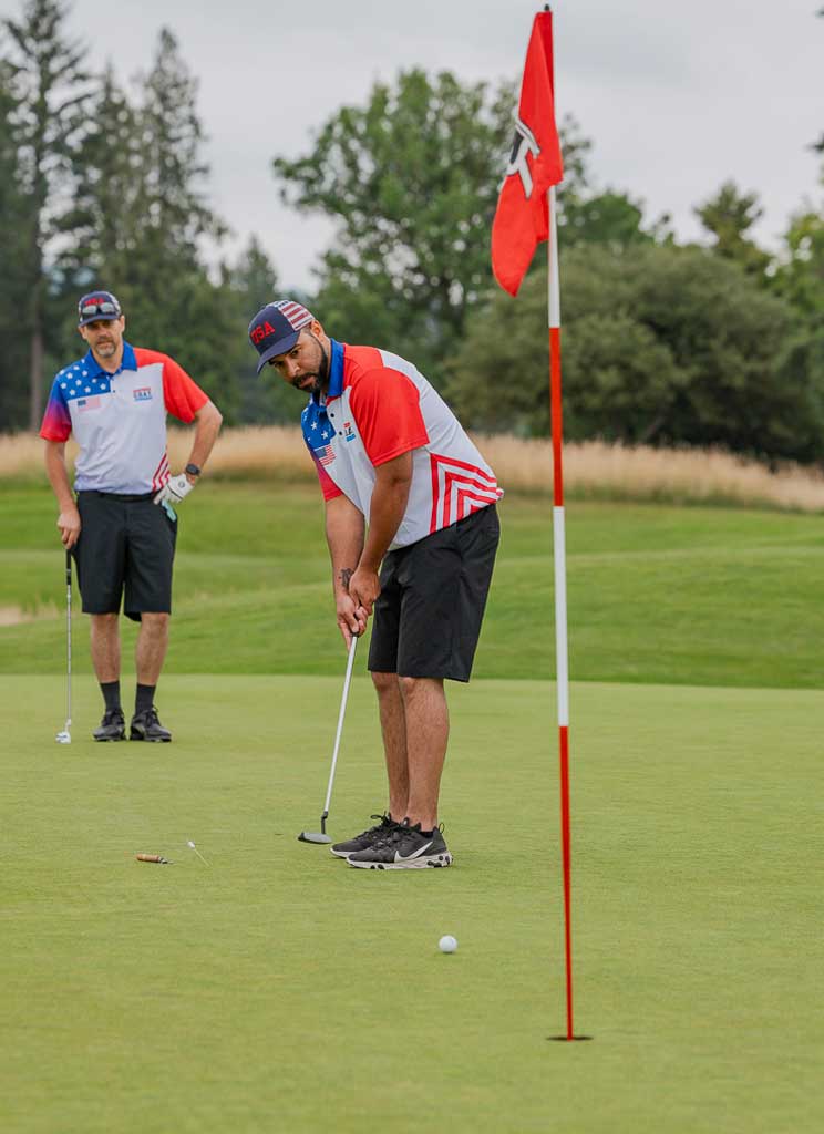 two men on a putting green