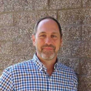 bearded man wearing a checked shirt