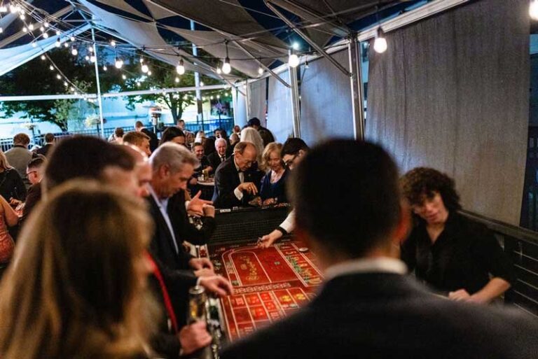 people playing at a casino table